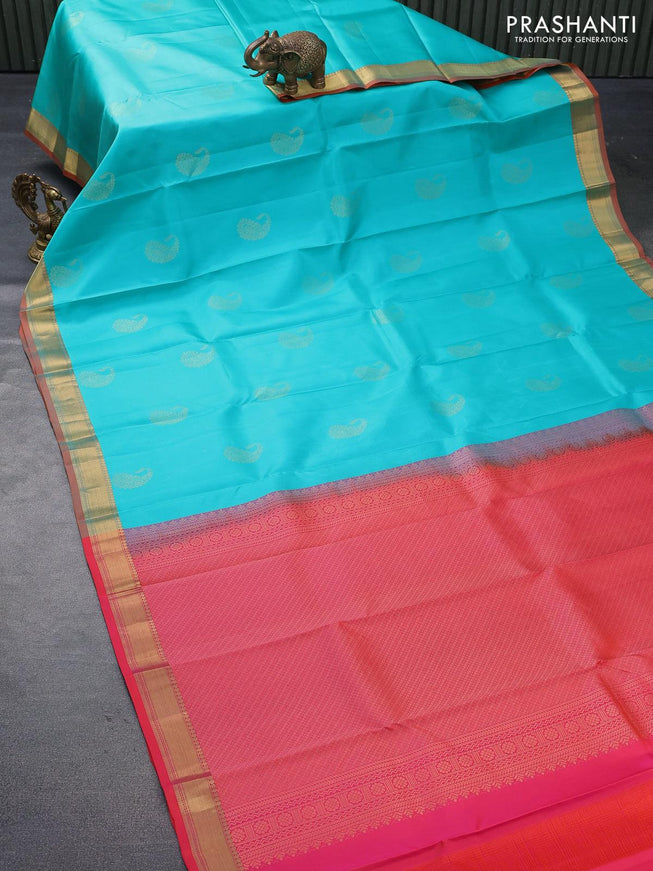 Pure kanjivaram silk saree teal blue and dual shade of pinkish orange with paisley zari woven buttas and zari woven border