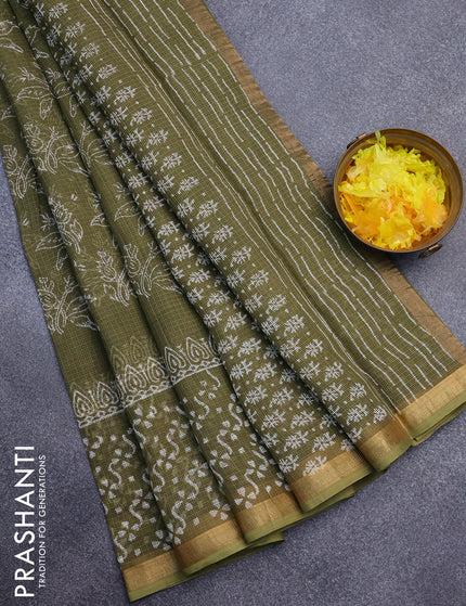 Kota saree sap greeen with allover prints and zari woven border