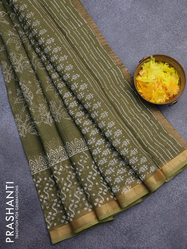 Kota saree sap greeen with allover prints and zari woven border