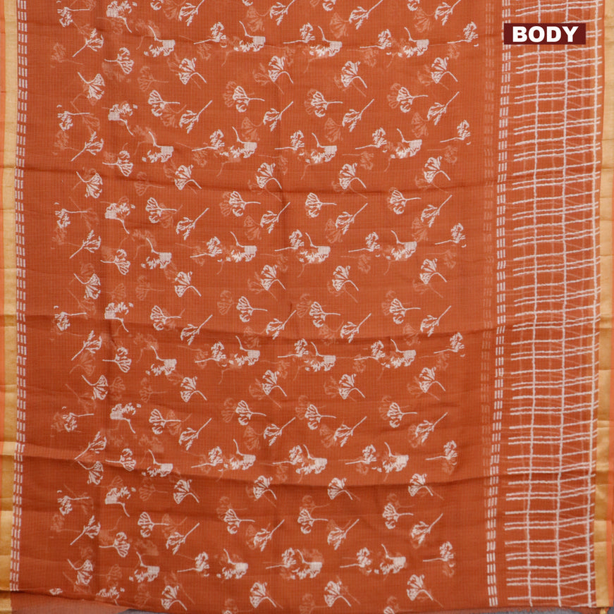 Kota saree rust shade with allover leaf butta prints and zari woven border