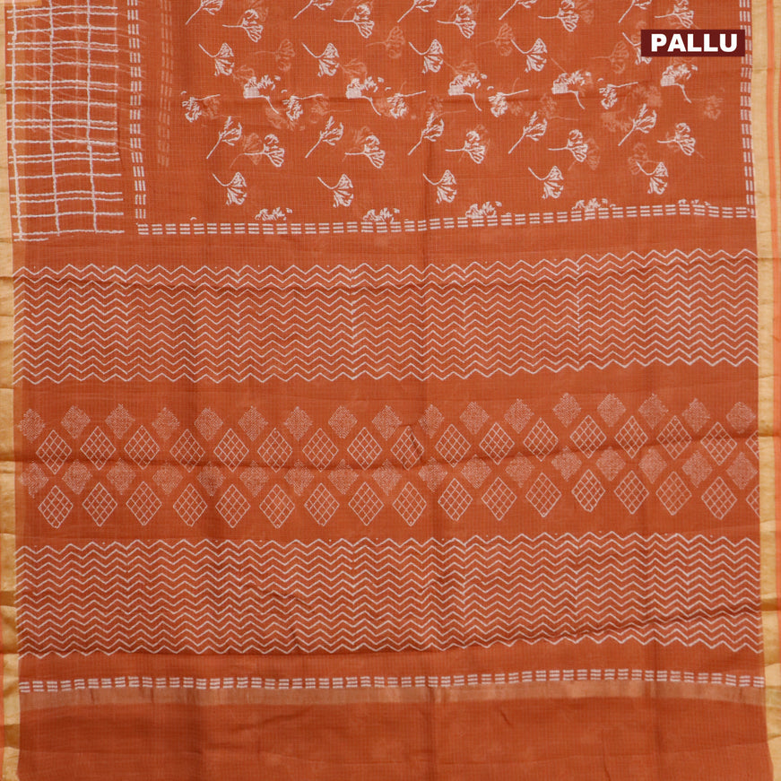 Kota saree rust shade with allover leaf butta prints and zari woven border