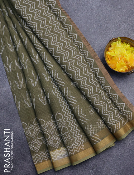 Kota saree sap green shade with allover butta prints and zari woven border