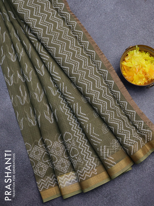 Kota saree sap green shade with allover butta prints and zari woven border