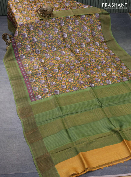 Pure tussar silk saree mustard yellow and green with allover prints and zari woven border -