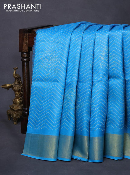 Pure tussar silk saree light blue with allover prints and zari woven border -