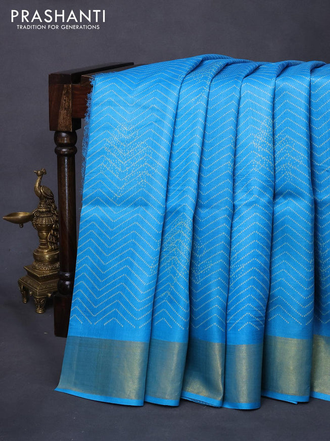 Pure tussar silk saree light blue with allover prints and zari woven border -