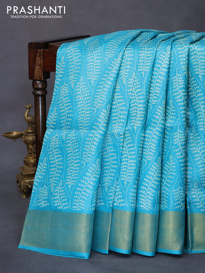 Pure tussar silk saree teal blue with allover prints and zari woven border -