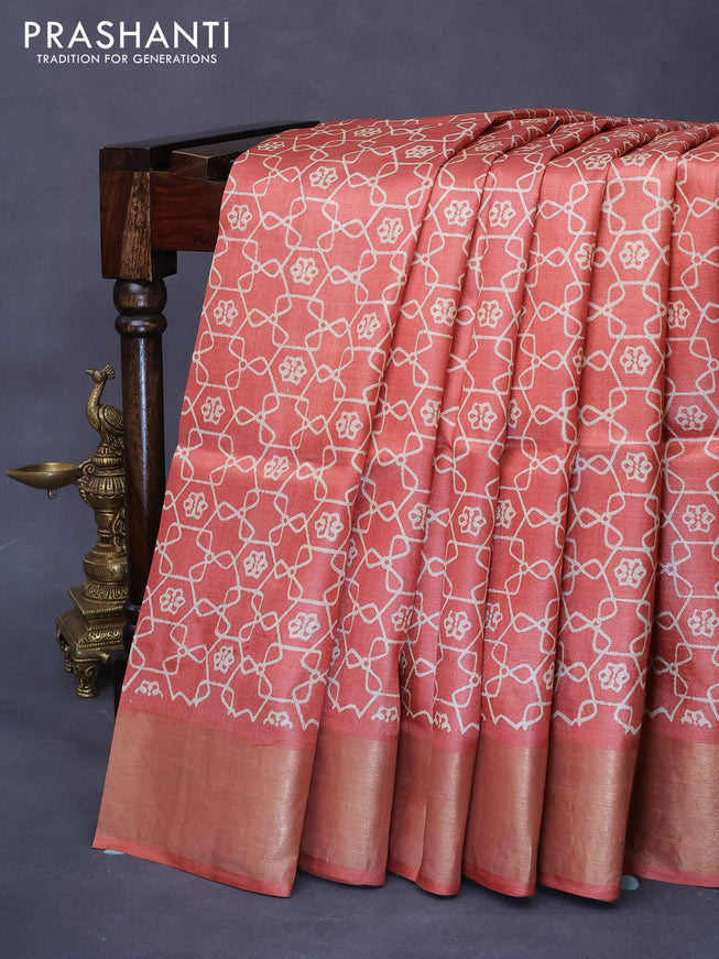 Pure tussar silk saree orange with allover geometric prints and zari woven border -