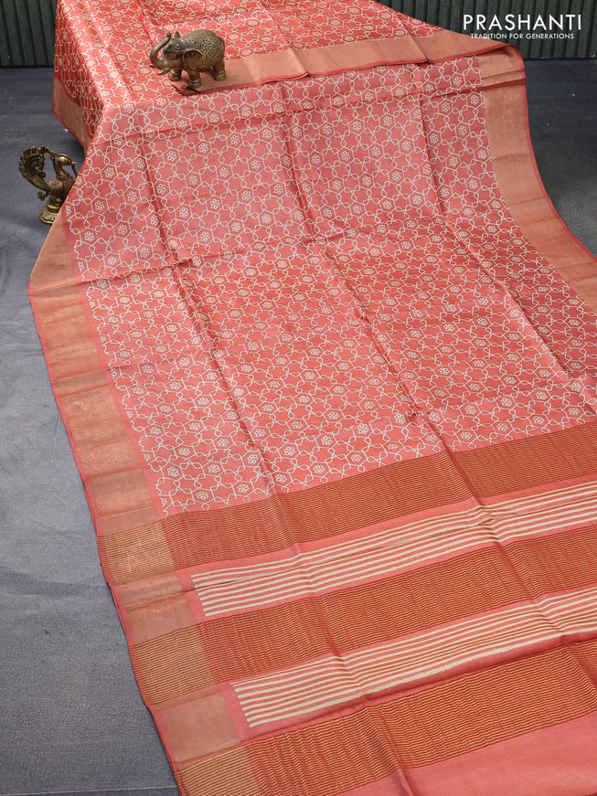 Pure tussar silk saree orange with allover geometric prints and zari woven border -
