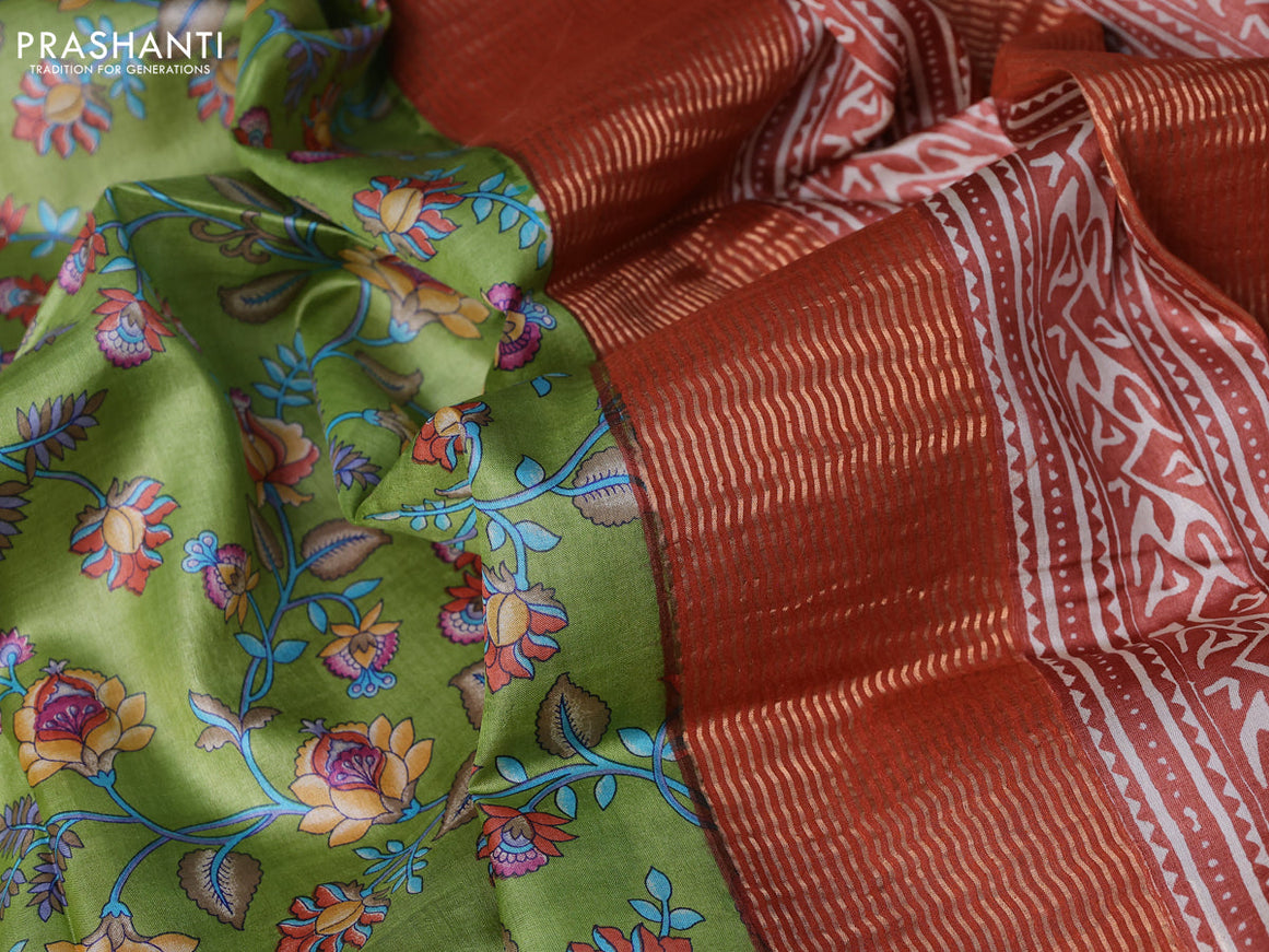Pure tussar silk saree light green and rust shade with allover prints and zari woven border -