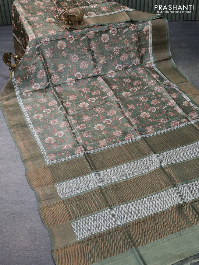 Pure tussar silk saree green shade with allover floral prints and zari woven border -