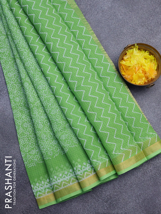 Kota saree light green with allover prints and zari woven border