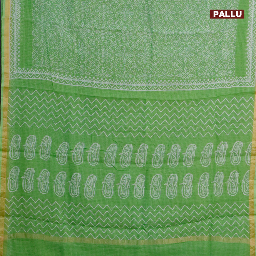 Kota saree light green with allover prints and zari woven border