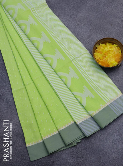 Khadi cotton saree fluorescent green with allover thread weaves and temple design simple border -