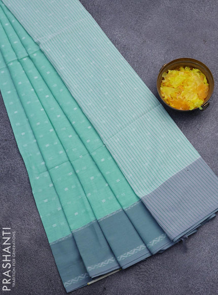 Khadi cotton saree teal blue and grey with allover thread woven buttas and simple border -