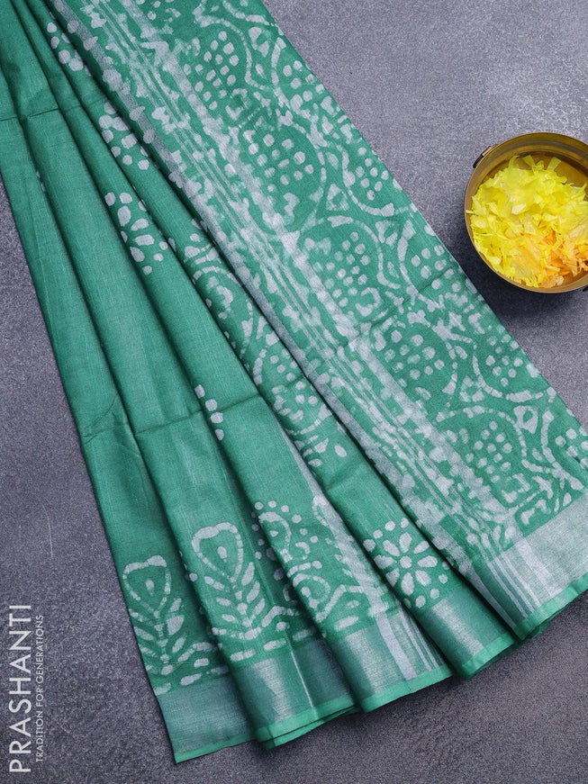 Linen cotton saree green with allover batik butta prints and silver zari woven border