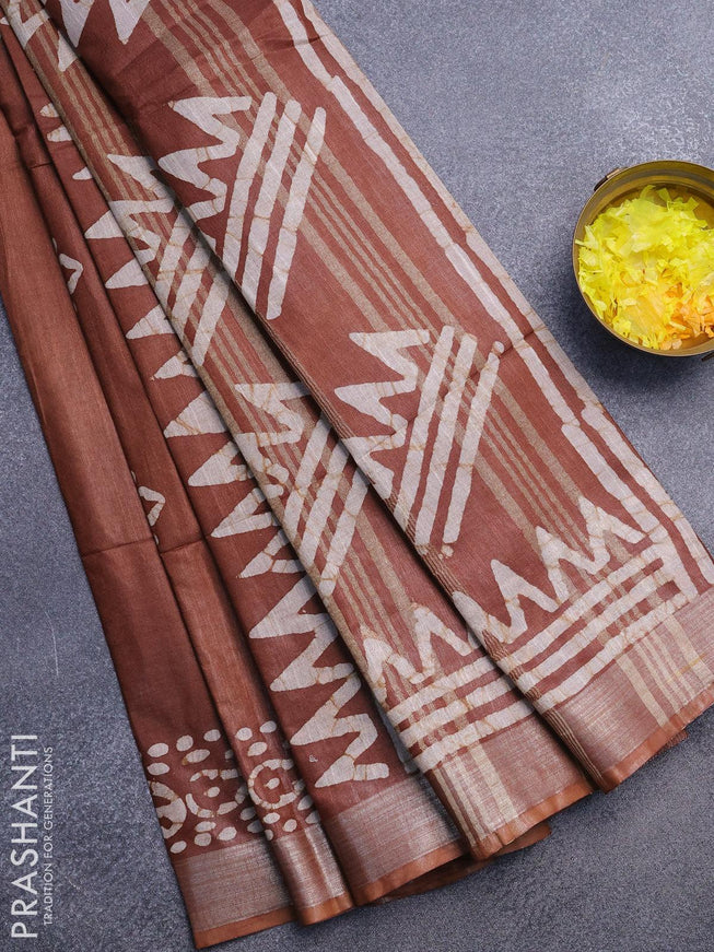 Linen cotton saree brown shade with allover batik butta prints and silver zari woven border