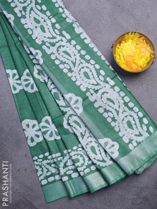 Linen cotton saree green with allover batik butta prints and silver zari woven border