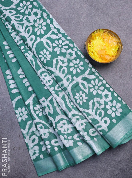 Linen cotton saree green with allover batik butta prints and silver zari woven border