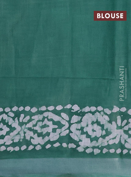 Linen cotton saree green with allover batik butta prints and silver zari woven border