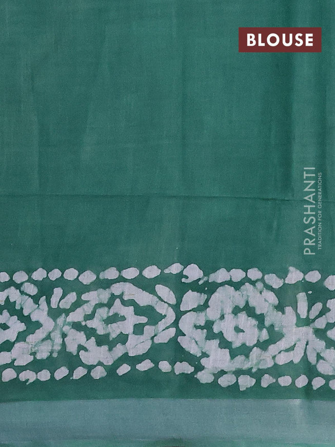 Linen cotton saree green with allover batik butta prints and silver zari woven border