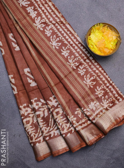 Linen cotton saree brown shade with allover batik butta prints and silver zari woven border