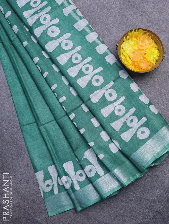 Linen cotton saree green with allover batik butta prints and silver zari woven border