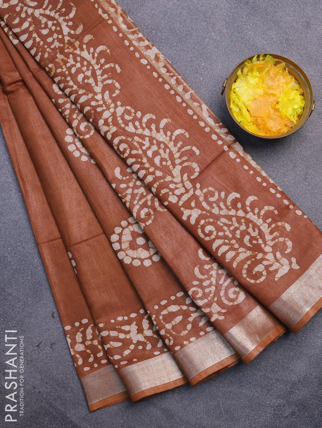 Linen cotton saree brown shade with allover batik butta prints and silver zari woven border