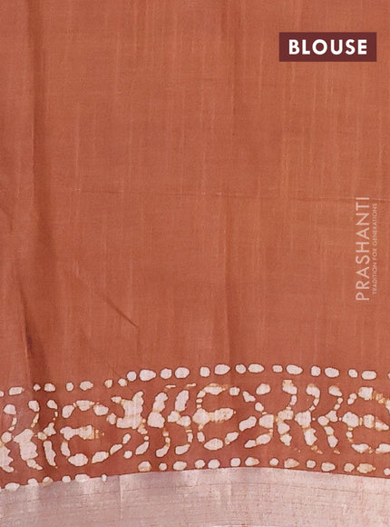 Linen cotton saree brown shade with allover batik butta prints and silver zari woven border