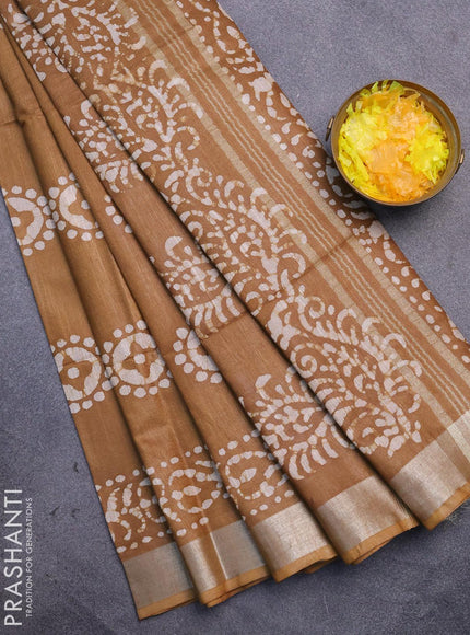 Linen cotton saree dark khaki shade with allover batik butta prints and silver zari woven border