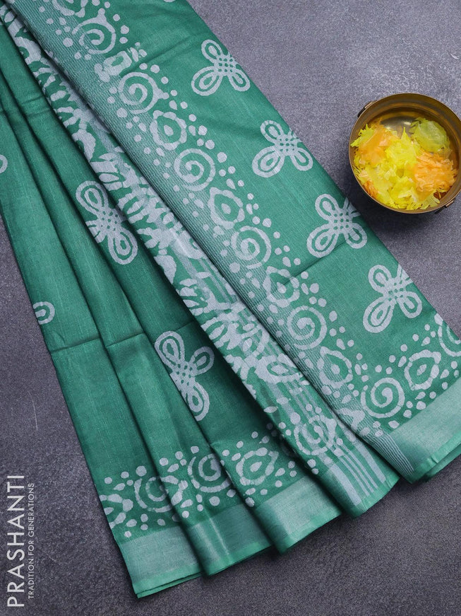 Linen cotton saree green with allover batik butta prints and silver zari woven border