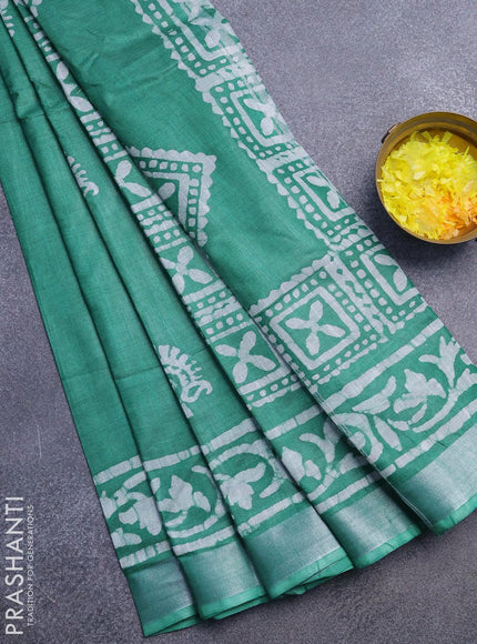 Linen cotton saree green with allover batik butta prints and silver zari woven border