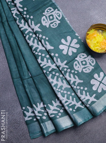 Linen cotton saree dark green with allover batik butta prints and silver zari woven border