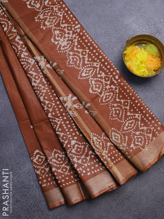 Linen cotton saree brown shade with allover batik butta prints and silver zari woven border