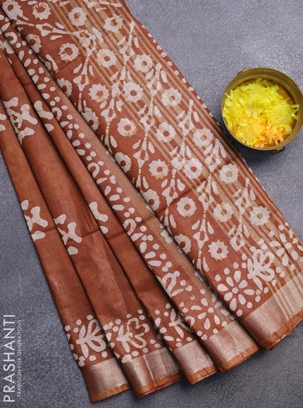 Linen cotton saree brown shade with allover batik butta prints and silver zari woven border