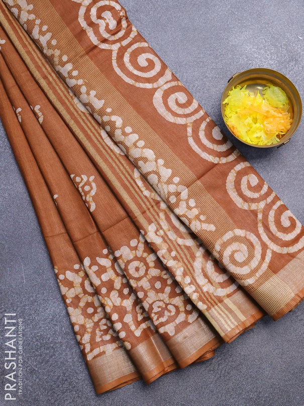 Linen cotton saree brown shade with allover batik butta prints and silver zari woven border