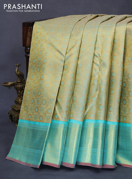 Pure kanjivaram tissue silk saree gold and teal blue with allover rudhraksha zari woven brocade weaves and rich zari woven border