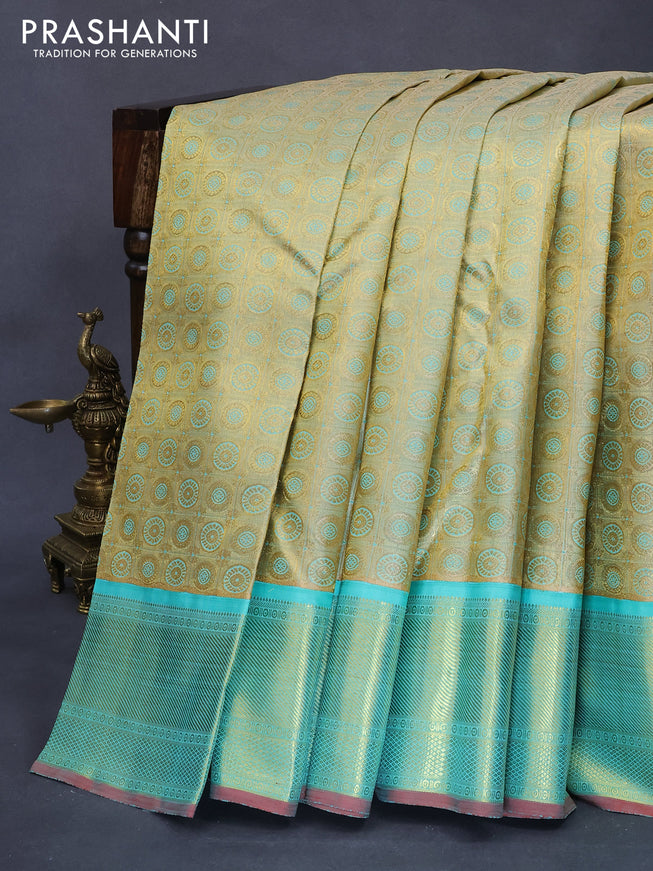 Pure kanjivaram tissue silk saree gold and teal blue with allover rudhraksha zari woven brocade weaves and rich zari woven border