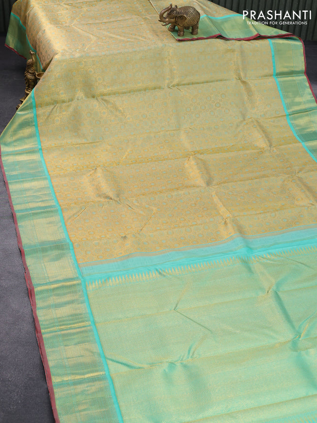 Pure kanjivaram tissue silk saree gold and teal blue with allover rudhraksha zari woven brocade weaves and rich zari woven border