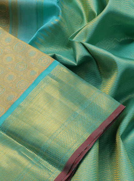 Pure kanjivaram tissue silk saree gold and teal blue with allover rudhraksha zari woven brocade weaves and rich zari woven border