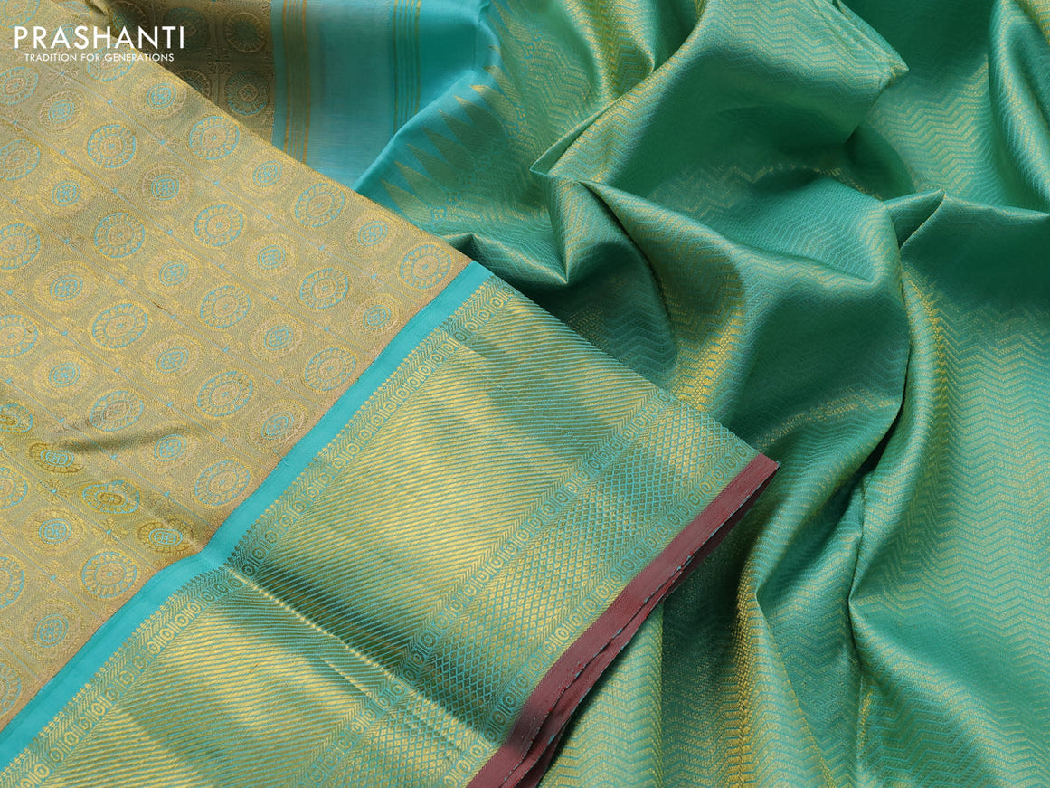 Pure kanjivaram tissue silk saree gold and teal blue with allover rudhraksha zari woven brocade weaves and rich zari woven border