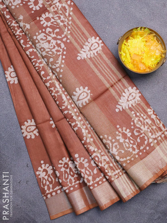 Linen cotton saree brown shade with allover batik butta prints and silver zari woven border