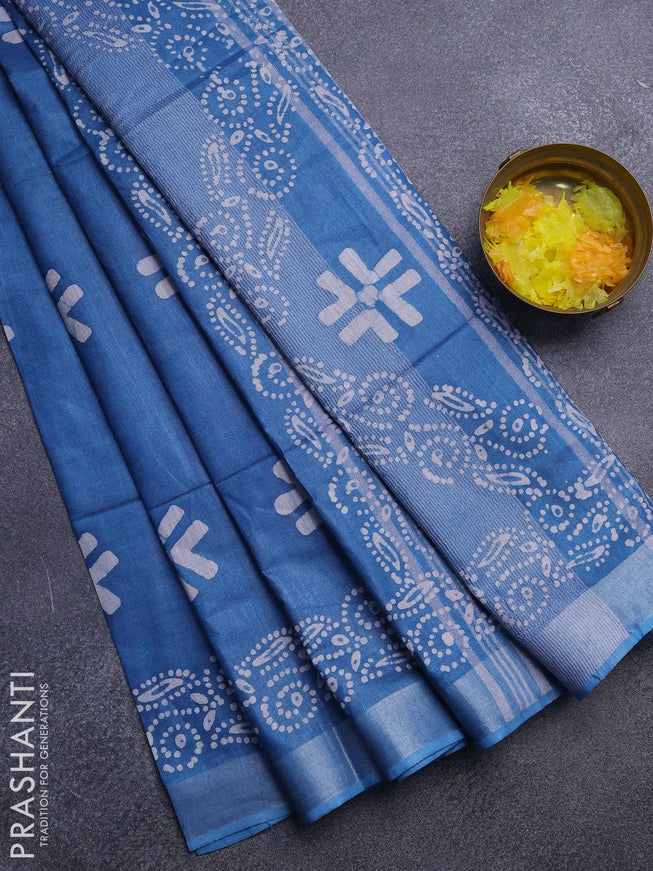 Linen cotton saree cs blue with allover batik butta prints and silver zari woven border