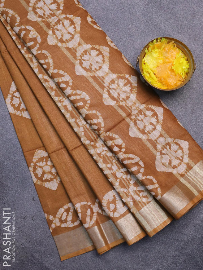 Linen cotton saree brown shade with allover batik butta prints and silver zari woven border