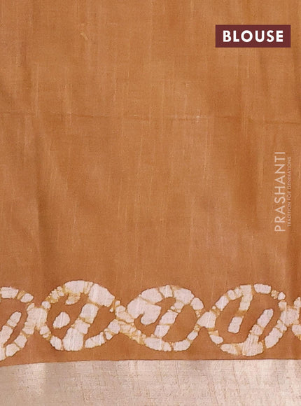 Linen cotton saree brown shade with allover batik butta prints and silver zari woven border