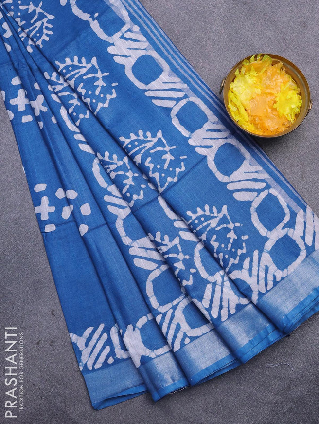 Linen cotton saree cs blue with allover batik butta prints and silver zari woven border