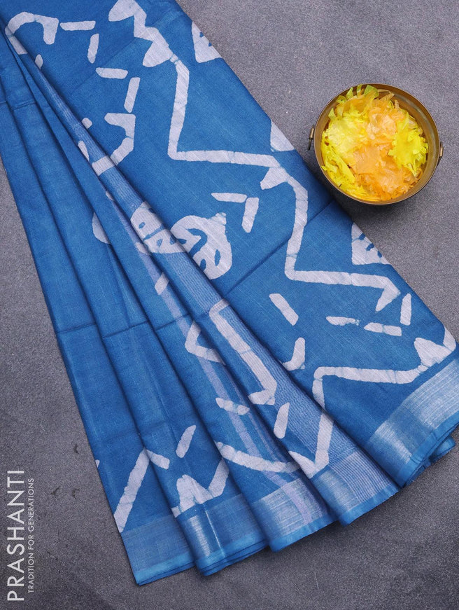 Linen cotton saree cs blue with allover batik butta prints and silver zari woven border