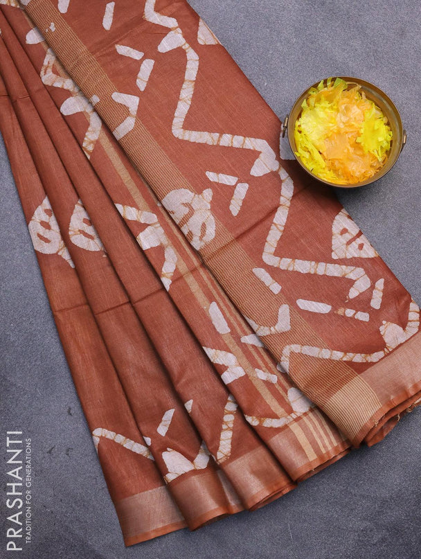 Linen cotton saree brown shade with allover batik butta prints and silver zari woven border