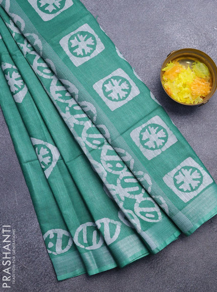 Linen cotton saree green with allover batik butta prints and silver zari woven border