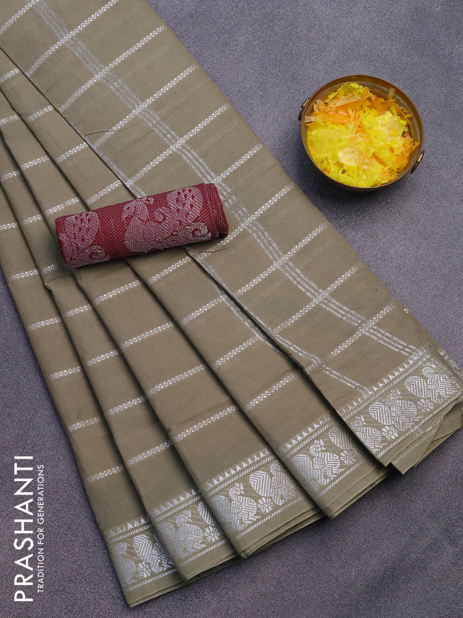 Sungudi cotton saree elaichi green and dark maroon with allover silver zari woven stripes pattern and silver zari woven border with separate blouse